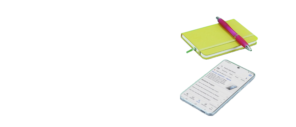 Le bloc-notes et le téléphone portable sont posés l'un à côté de l'autre.